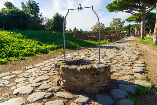 Ostia antica in Rome, Italy. Medieval water well built on an ancient Roman road