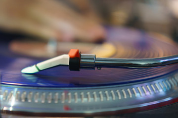 Photography of modern vinyl turntable with vinyl plate. Listen to music. Close view from above.
