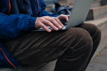 freelancer businessman working on laptop outdoors