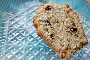 Cake with raisins on a glass surface with an ornament