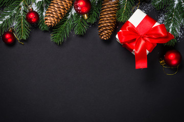 Fototapeta na wymiar Christmas background with decorations on black.