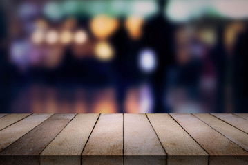 Wood table on blurred  cafe, coffee shop, bar, background.