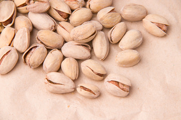Pistachios on paper. Snacks.