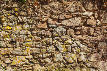 Old wall masonry in Portugal along the street