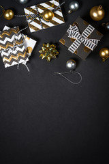 Fototapeta na wymiar Christmas background with decorations on black.