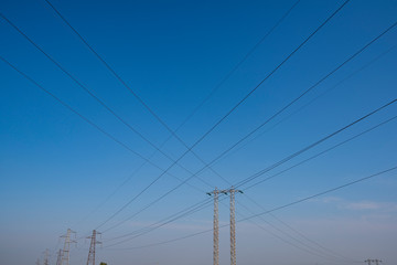 industrial landscape of high voltage pylons