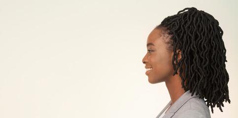Studio Portrait Of Smiling African American Businesswoman, Side View, Panorama