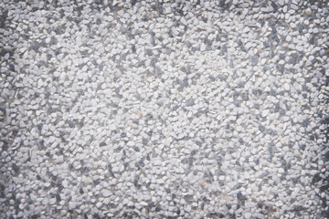 Exposed aggregate concrete wall texture or white gray and black terrazzo stone background