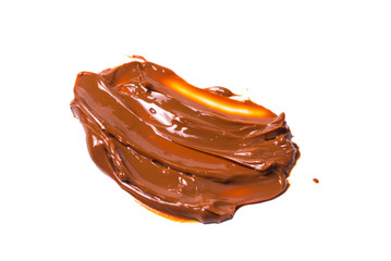 Melted tasty caramel splashes isolated on white background.