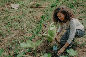 Women little with hoe working in garden