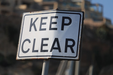 Keep clear road sign on blur background, horizontal