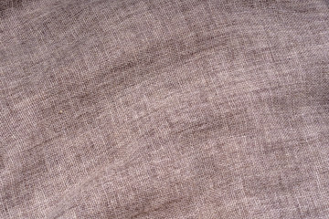 Crumpled textile texture as a background. Natural fabric linen texture for design. Closeup