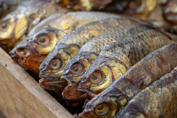 Smoked fish for sell in street food market, Ukraine, closeup
