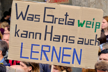 Placard "Hans can also learn what Greta knows" in German language on a global climate strike