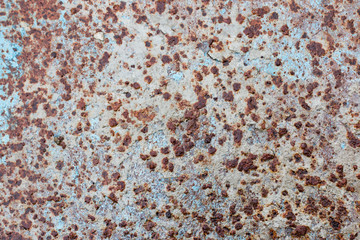 Background. Texture of old, rusty iron with spots of blue paint.