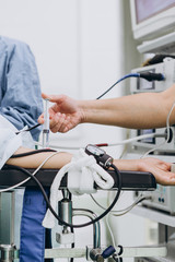 close up of hand of surgeons in hospital doing minimal invasive surgical interventions. Surgery operating room with electrocautery equipment for cardiovascular emergency surgery center