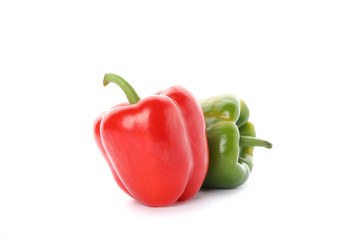 Green and red bell peppers isolated on white background