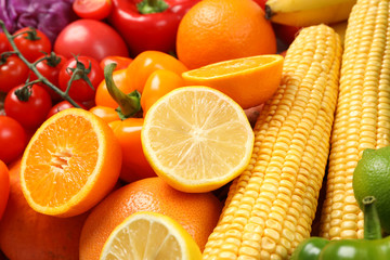 Ripe vegetables and fruits on whole background, close up