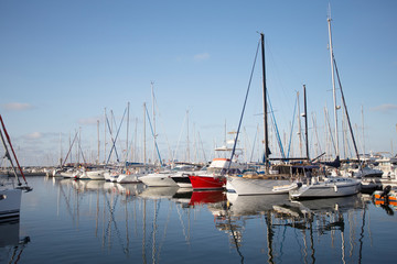 Fototapeta na wymiar Boats Docked at the Sea Port. Boats Docked at the Yacht Club at sunset