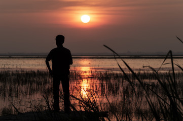 A man standing on a bridge