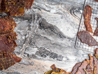 dried marbled meat pieces, dehydrateed slices in spices salted, copy space