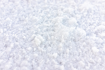 Macro closeup view on texture of Bonneville salt flats with wet salt on ground abstract