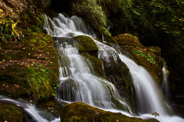 Fototapeta premium Water cascade between the rocks of a river