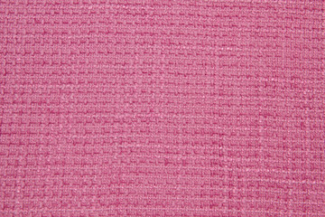 Boucle red fabric. The texture of the jacquard fabric	