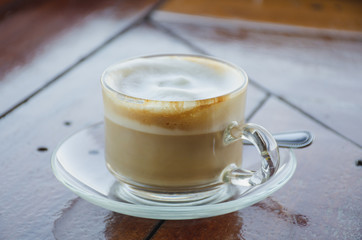 Coffee cup of hot with on wooden floor place for message.