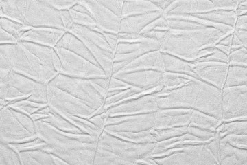 White crumpled leather texture. fabric with folds imitation under genuine leather. background. wallpaper