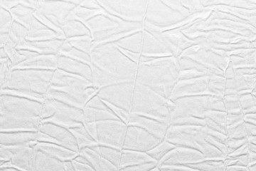 White crumpled leather texture. fabric with folds imitation under genuine leather. background. wallpaper
