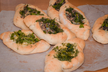 Homemade meat pie on wooden table close-up with, rustic style