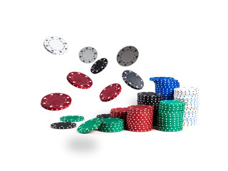 Colorful chips in piles are flying apart, isolated on white background. Close-up photo. Gambling entertainment.
