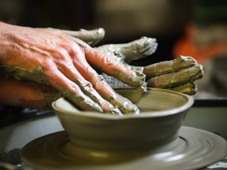 Creating hands molding pottery. Mugs made of clay