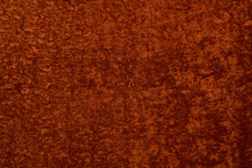 Red eco fur sheepskin. Texture of Astrakhan fur