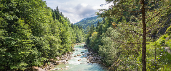 Landscape panorama of a blue river in a forest in Austria