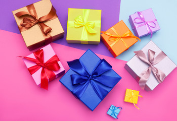 Obraz na płótnie Canvas Multi-colored gift boxes with bow. Flatlay
