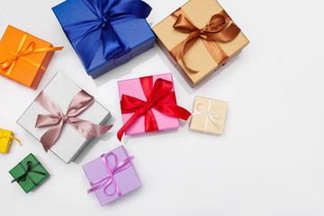 Fototapeta na wymiar Multi-colored gift boxes with bow. Flatlay