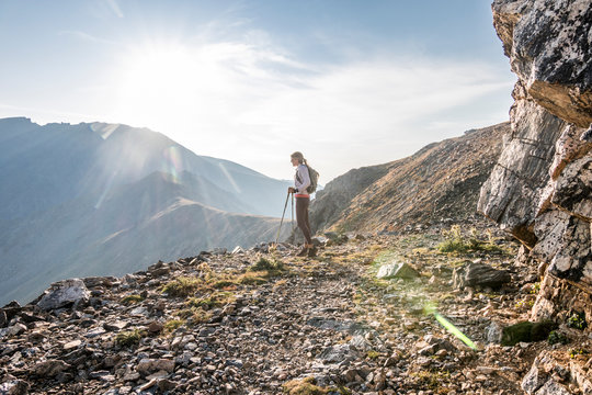 A Young Woman Trail Runner Takes A Break High Up On Arapaho Pass