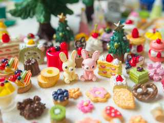 Merry Chrismas with a lot of miniature toys. Sweet party, dessert table toy concept.