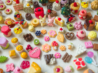 Fototapeta na wymiar Merry Chrismas with a lot of miniature toys. Sweet party, dessert table toy concept.