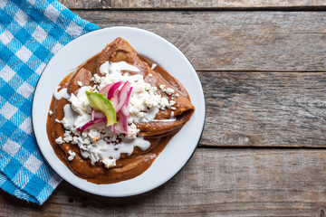 Mexican tacos with beans sauce and fresh cheese also called 