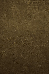 Urban concrete wall background with grooves and bubbles. Cement gray wall. Urban and industrialization art concept. Texture like concrete, stone, cement, plaster.. Poster mockup. Сloseup studio shot.