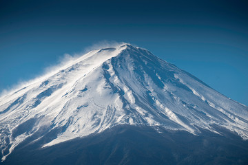 Close up top of beautiful Fuji mountain with snow cover on the top with could, Japan winter season