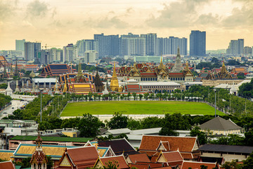 Urban City Skyline, Wat Arun, Wat Pho and Wat Phra Kaew or Grand Palace at twilight in Bangkok, Thailand.