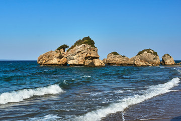 Fototapeta na wymiar Rocks and boulders on the coast of the island of Zakynthos in Greece.