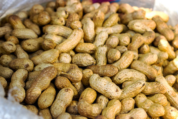 Peanut background food. peanuts in shell texture. Close-up of peanuts in shkarlupe view from above.