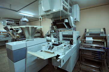 At the production hall of the Dutch bakery: bread make-up machine, dough forming machine,  dough mixing machine, automatic dough line, electric oven 
