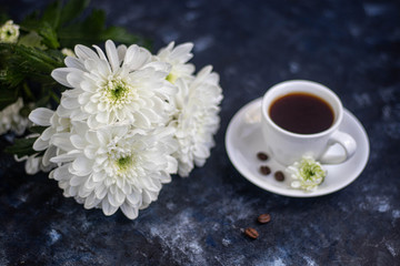 cup of tea with white flowers