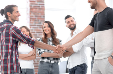 handshake Manager and customer in the office.